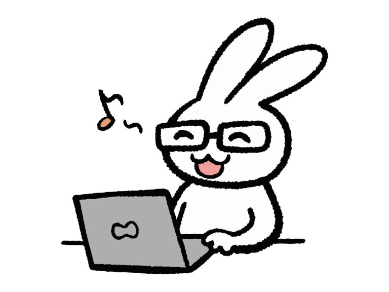 パソコンで仕事をして喜ぶメガネのうさぎ